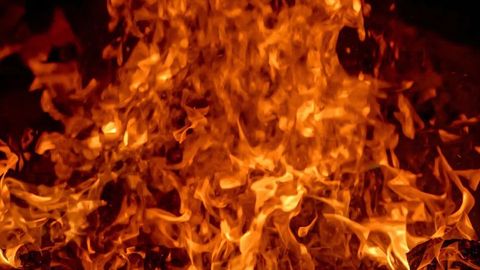 Dynamic swirling flames with glowing embers intensity