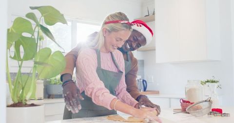 Festive Couple Baking Together in Bright Home Kitchen