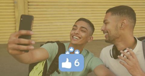 Youthful Friends Selfie with Likes Overlay in Urban Setting