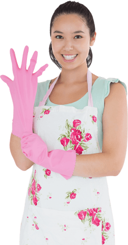 smiling woman putting on transparent rubber gloves in floral apron - Download Free Stock Videos Pikwizard.com