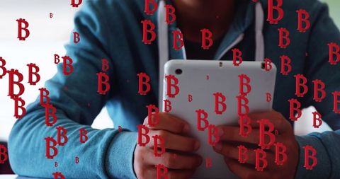 Using Tablet with Bitcoin Symbols in Digital Business Concept