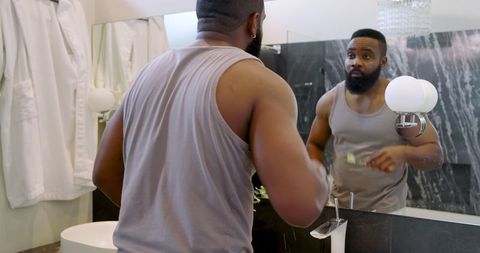 African american man grooming in luxury bathroom