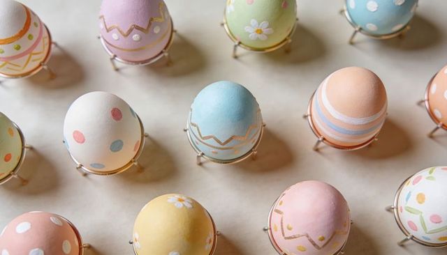 Pastel easter eggs flatlay with hand-painted dots stripes zigzag and floral accents