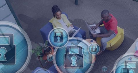 Coworkers Collaborating with Digital Security Icons Overlay