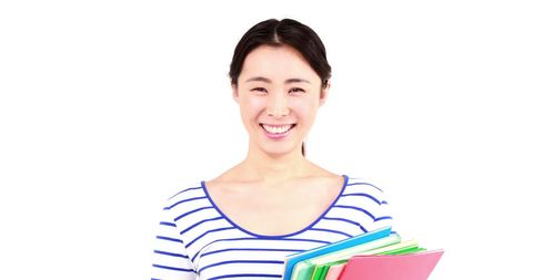 Smiling Woman Holding Books Against White Background - Download Free Stock Images Pikwizard.com