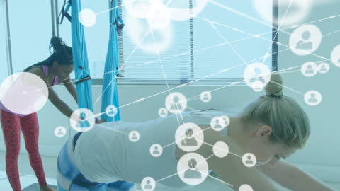 Women Practicing Aerial Yoga with Tech Overlay Concept