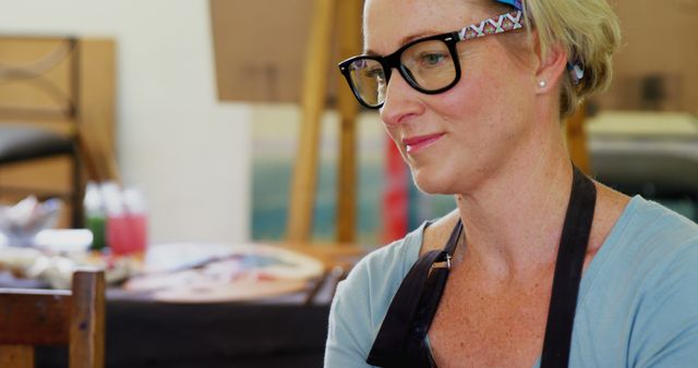 Female Artist Wearing Glasses Creating Artwork In Studio - Download Free Stock Images Pikwizard.com