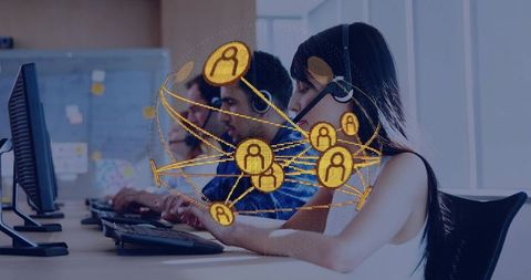 Customer Support Team Typing at Open-Plan Desk with Network Overlay Showing Connections
