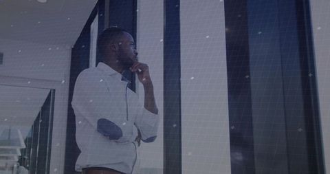 Thoughtful businessman in modern corporate environment