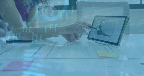 Business Professional Analyzing Data on Tablet for Financial Insights