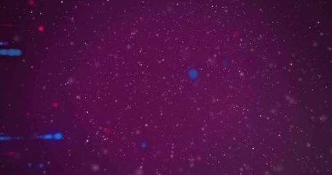 Glowing magenta particle field creating depth with blue and red bokeh