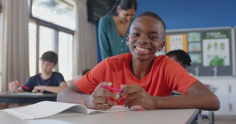Smiling Student Engages in Classroom Activity