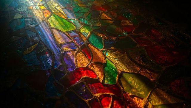 Colorful glass shard mosaic reflecting light in abstract design