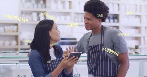 Diverse Shop Assistants Engaging with Digital Data Overlay