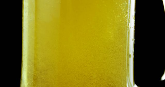 Close-Up of Bubbling Beer in a Glass Mug with Black Background - Download Free Stock Images Pikwizard.com