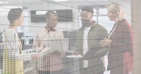 Diverse Business Team Discussing Financial Data Trends in Office