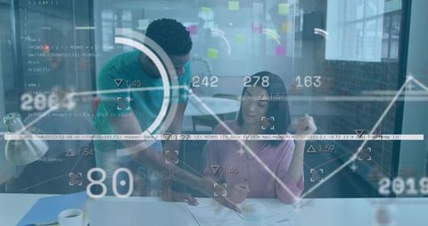 Young professionals collaborating over documents with data overlay and analytics dashboard