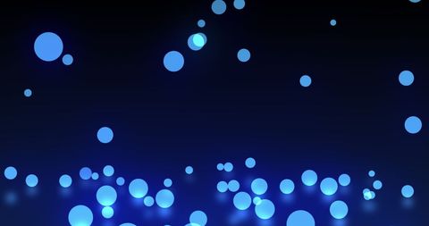 Blue bokeh snowflakes on night background