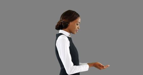 Confident African American Businesswoman Holding Invisible Object