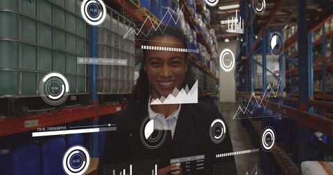 Smiling warehouse manager analyzing digital data visuals