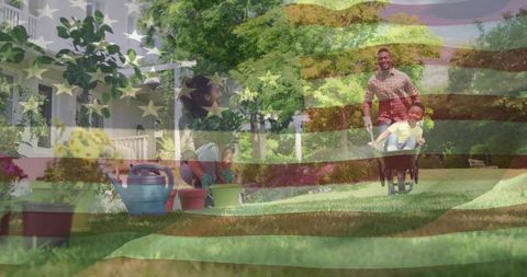 Happy family gardening together in sunny suburban yard