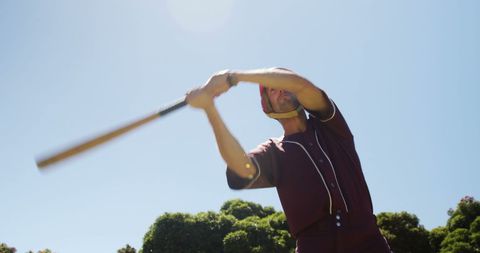 Baseball Batter Swinging Bat Under Clear Blue Sky - Download Free Stock Images Pikwizard.com