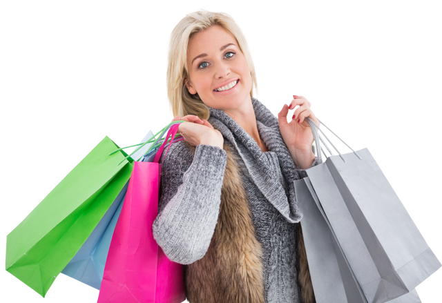 Smiling Blonde Woman in Winter Clothes Holding Shopping Bags Transparent Background - Download Free Stock Videos Pikwizard.com