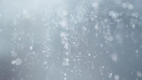 Drifting Blue Particles Creating Soft Bokeh Glow Macro Abstract Motion Background