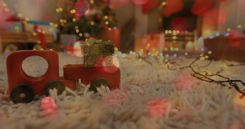 Festive Living Room with Christmas Toy Train and String Lights - Download Free Stock Images Pikwizard.com