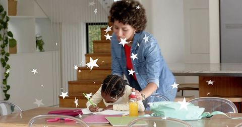 Caregiver guiding child writing at kitchen table with backpack, supplies, star overlay