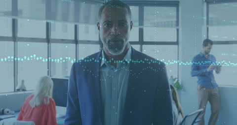 Businessman Focused on Economic Data in Modern Office Environment