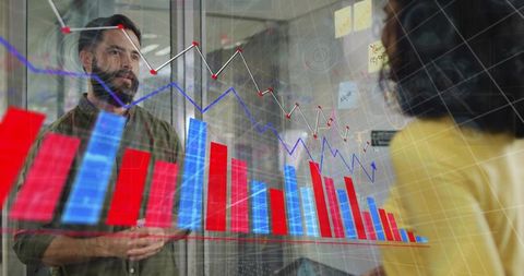Colleagues collaborating over glass data visualization with bar and line charts