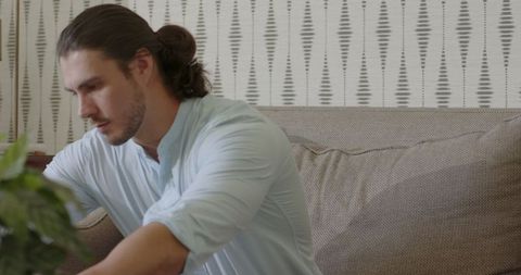 Man Deep in Thought Using Laptop at Home Office