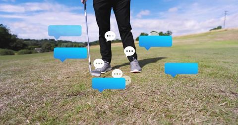 Golfer standing on fairway preparing swing with club, ball and floating chat bubbles app