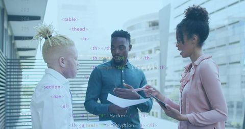 Business team discussing cybersecurity concepts on office balcony with code overlay