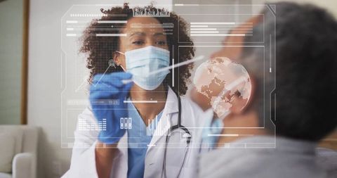Female medic performing nasal swab with high-tech interface