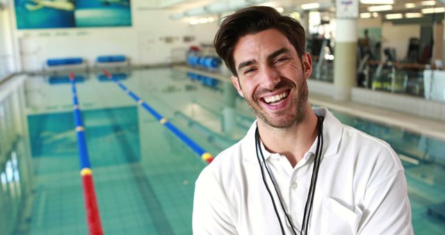 Smiling Swimming Coach by Indoor Pool - Download Free Stock Images Pikwizard.com