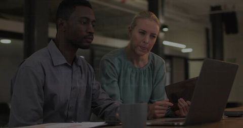 Diverse Professionals Collaborating on Business Project in Office