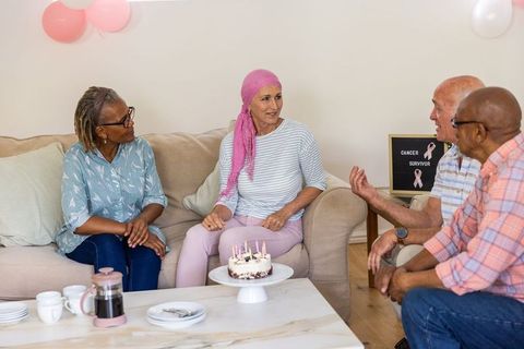 Diverse Friends Celebrating Cancer Survivor at Home Gathering