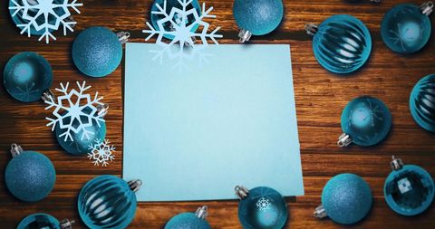 festive blue christmas baubles with snowflakes around blank paper - Download Free Stock Images Pikwizard.com
