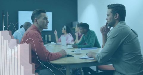 Team engaged in strategy discussion around conference table