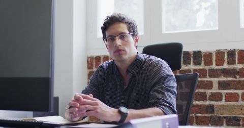 Modern Businessman Contemplating in Loft Office Atmosphere