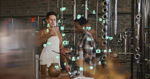 Worker Analyzing Craft Liquor with Data Overlay in Distillery