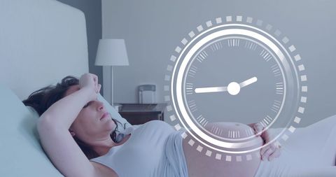 Exhausted pregnant woman resting in bedroom with time projection