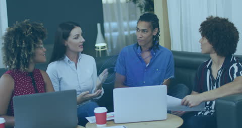 Diverse Business Team Discussing 6G Concepts in Modern Office