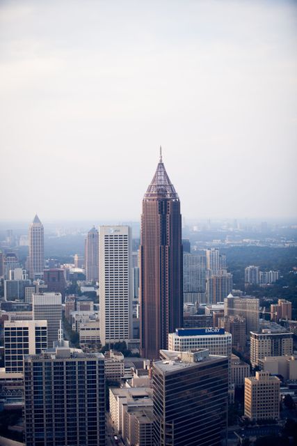 Atlanta's iconic skyline featuring prominent high-rise buildings. Ideal for presentations on urban development, tourism, business, or travel. Great for illustrating modern architecture, city life, or marketing materials showcasing major American cities.
