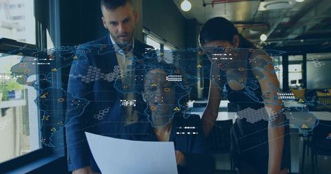 Business team analyzing global data with world map overlay