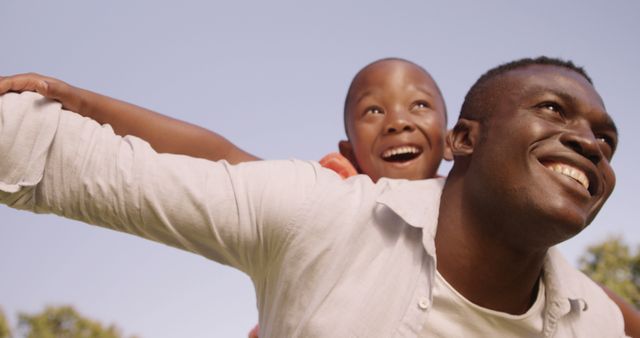 Happy Father with Son Playing Outdoors during Sunny Day - Download Free Stock Images Pikwizard.com