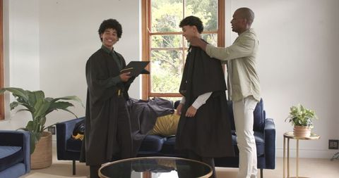 Proud Family Celebrates Graduation Day Together at Home