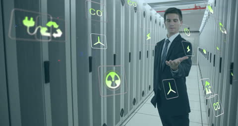 Businessman in Server Room with Futuristic Data Icons